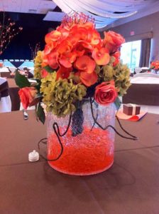 a pink rose centerpiece used for a wedding catering