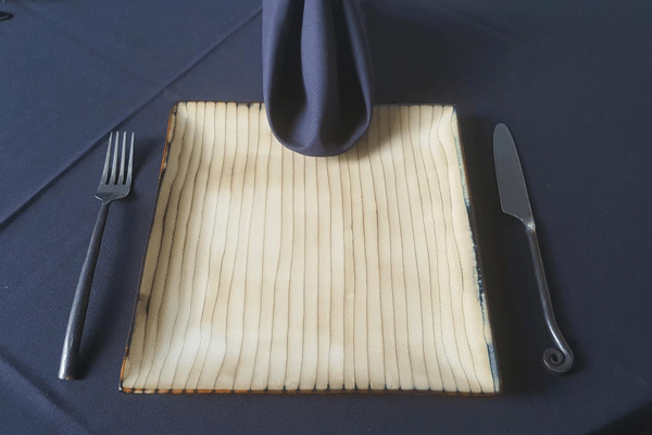 catering plates and silverware that looks like bamboo