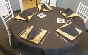 a table set up for formal catering
